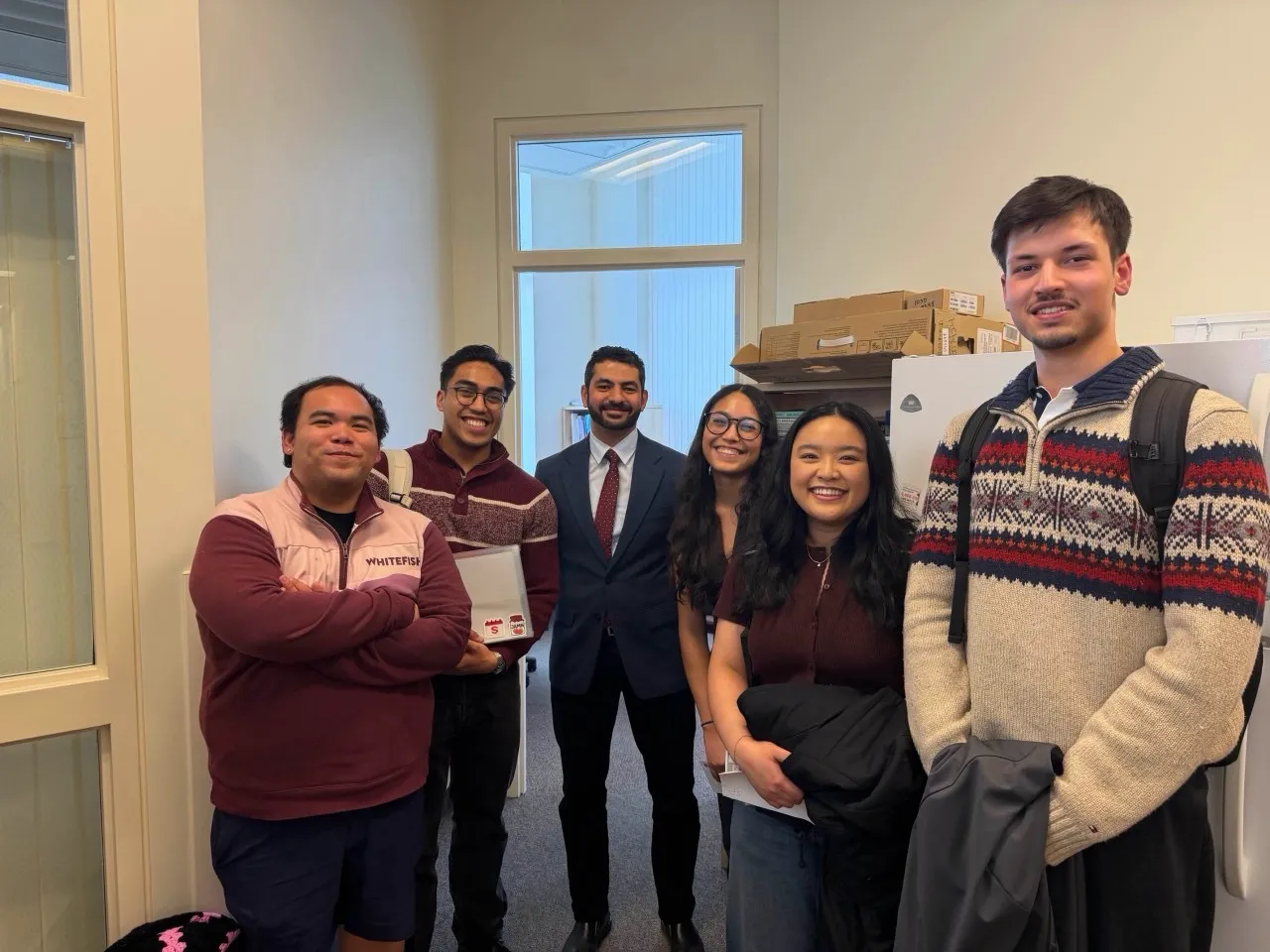 The Schedulater team standing together after the competition